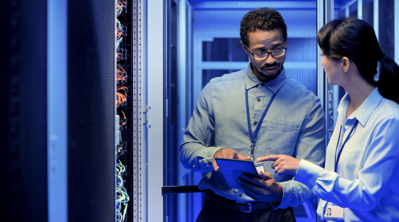 IT engineers using digital tablet